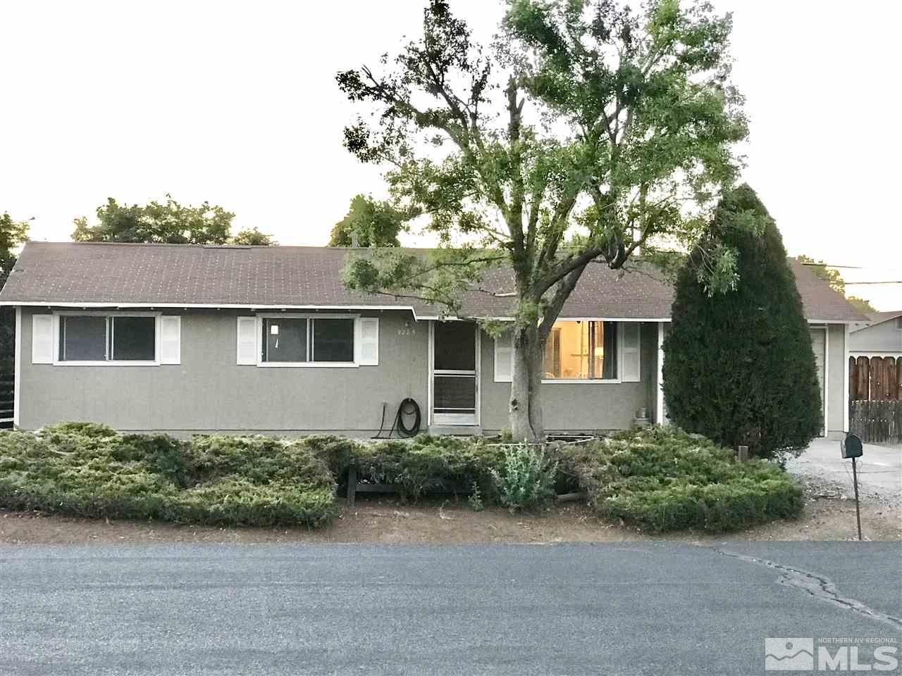 9285 Fremont Way Reno, NV 89506 - Photo 18 of 21 a front view of a house with garden