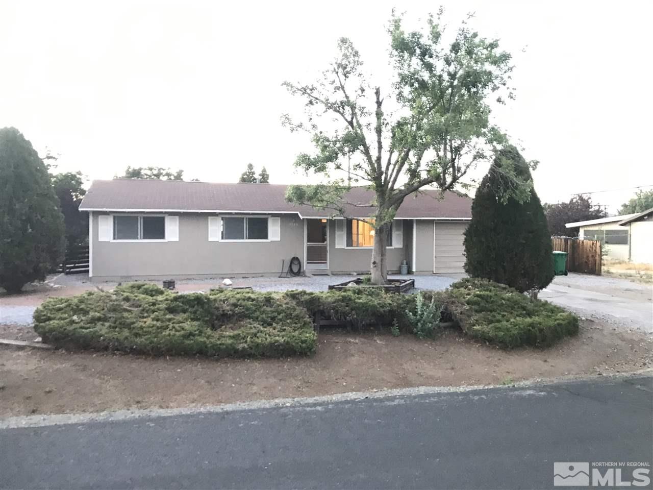 9285 Fremont Way Reno, NV 89506 - Photo 19 of 21 a front view of a house with garden