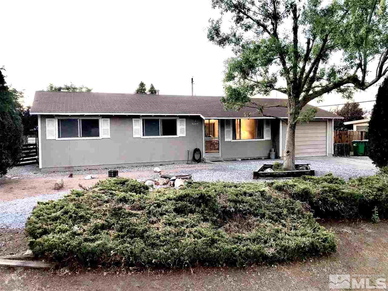9285 Fremont Way Reno, NV 89506 - Photo 20 of 21 a front view of a house with a yard