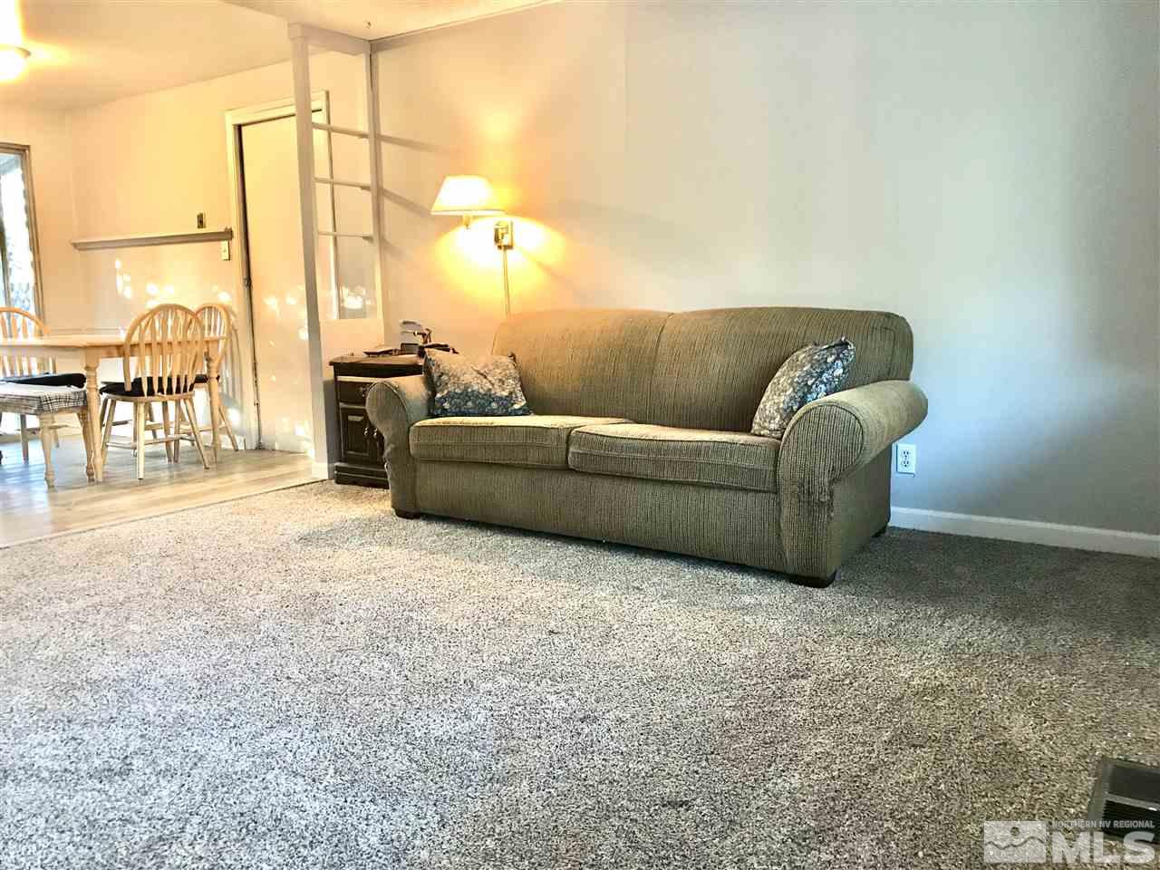 9285 Fremont Way Reno, NV 89506 - Photo 9 of 21 a living room with furniture a ceiling fan