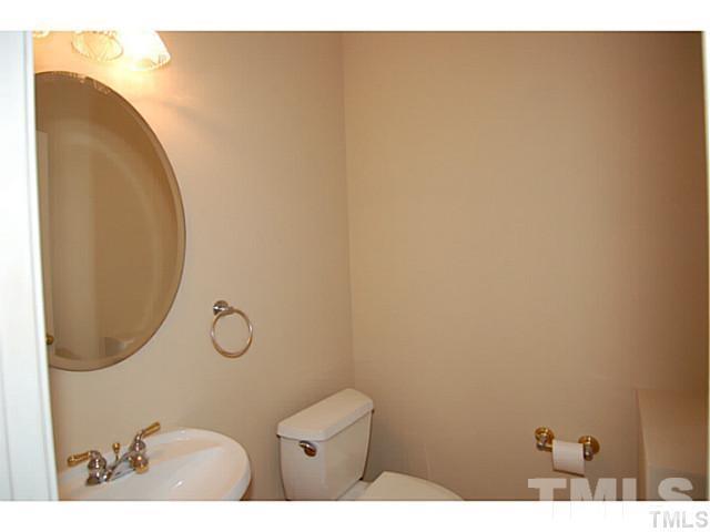 3506 Proprietor Way Raleigh, NC 27612 - Photo 14 of 19 a bathroom with a sink mirror and vanity