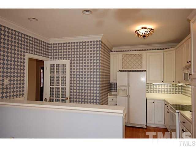 3506 Proprietor Way Raleigh, NC 27612 - Photo 4 of 19 a kitchen with a refrigerator and a stove