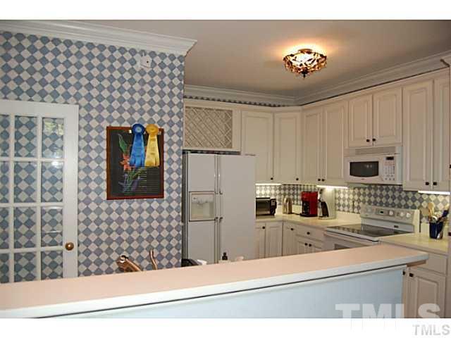 3506 Proprietor Way Raleigh, NC 27612 - Photo 5 of 19 a kitchen with a sink and cabinets