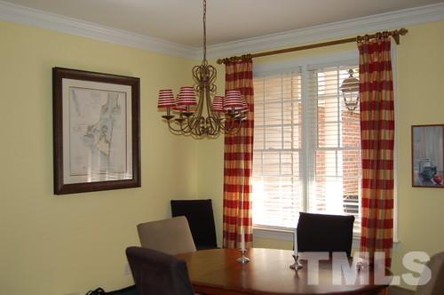 3506 Proprietor Way Raleigh, NC 27612 - Photo 7 of 19 a view of a dining room with furniture and windows