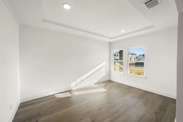 a view of kitchen and microwave with wooden floor
