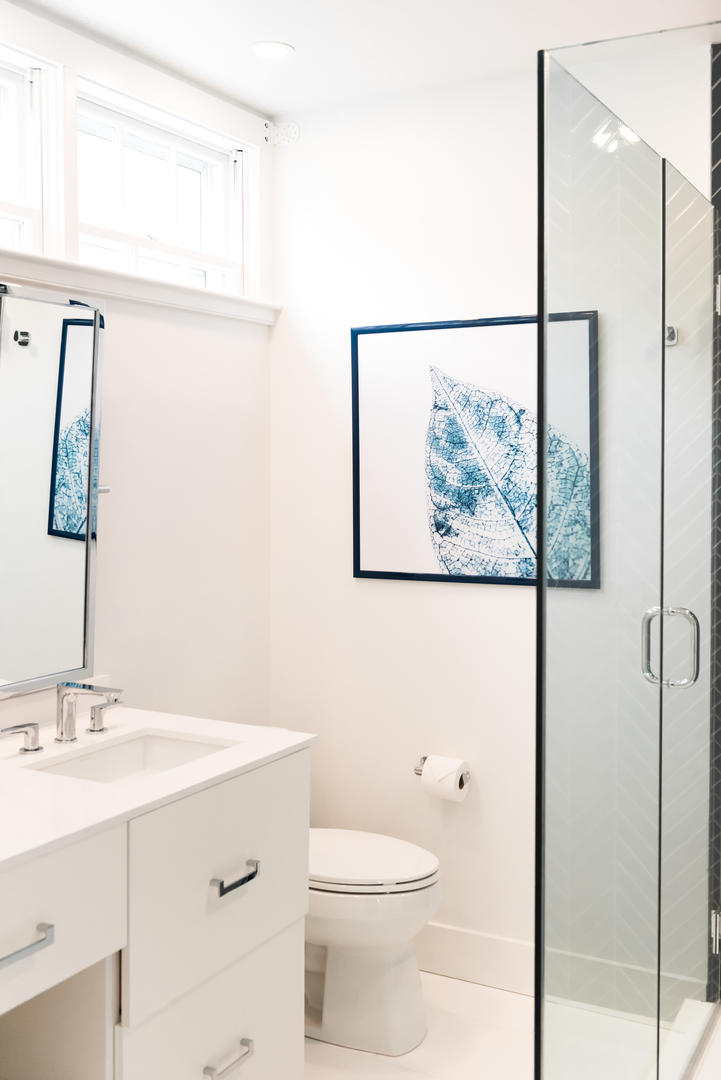 59 Orange Street Nantucket, MA 02554 - Photo 18 of 42 a bathroom with a toilet a sink and a mirror