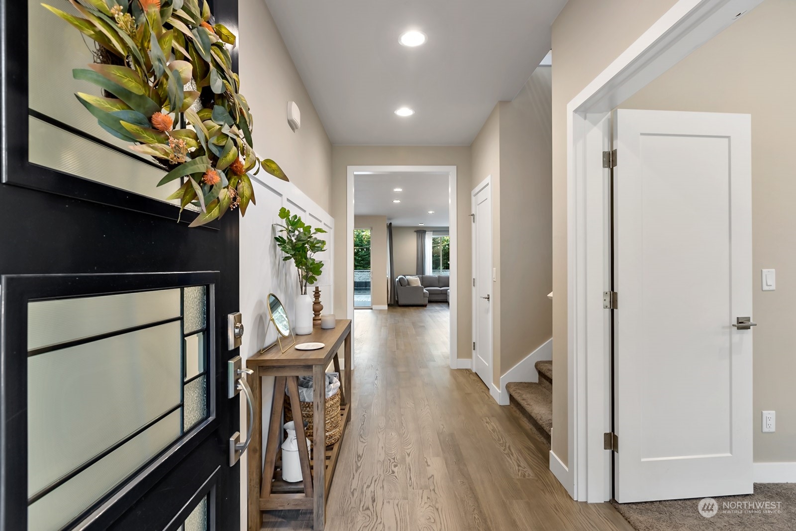 853 South 49th Street Renton, WA 98055 - Photo 3 of 35 a view of a hallway view with wooden floor and staircase