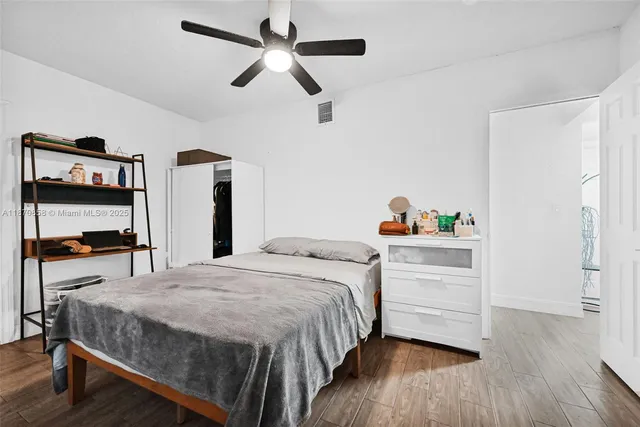 a kitchen with a stove and white cabinets