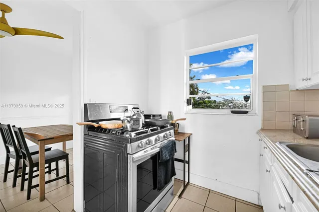 a bedroom with furniture and a potted plant