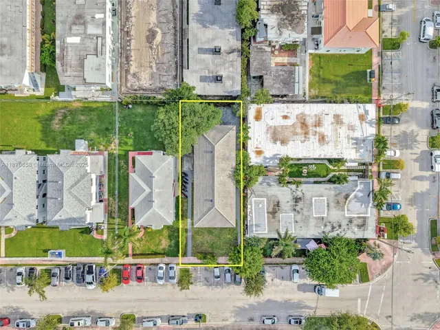 a front view of a house with a yard table and chairs
