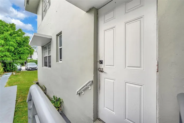 a view of entryway with wooden floor
