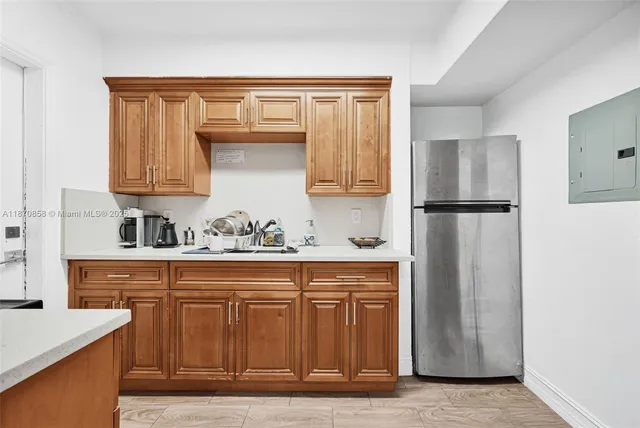 a kitchen with stainless steel appliances granite countertop a sink and cabinets