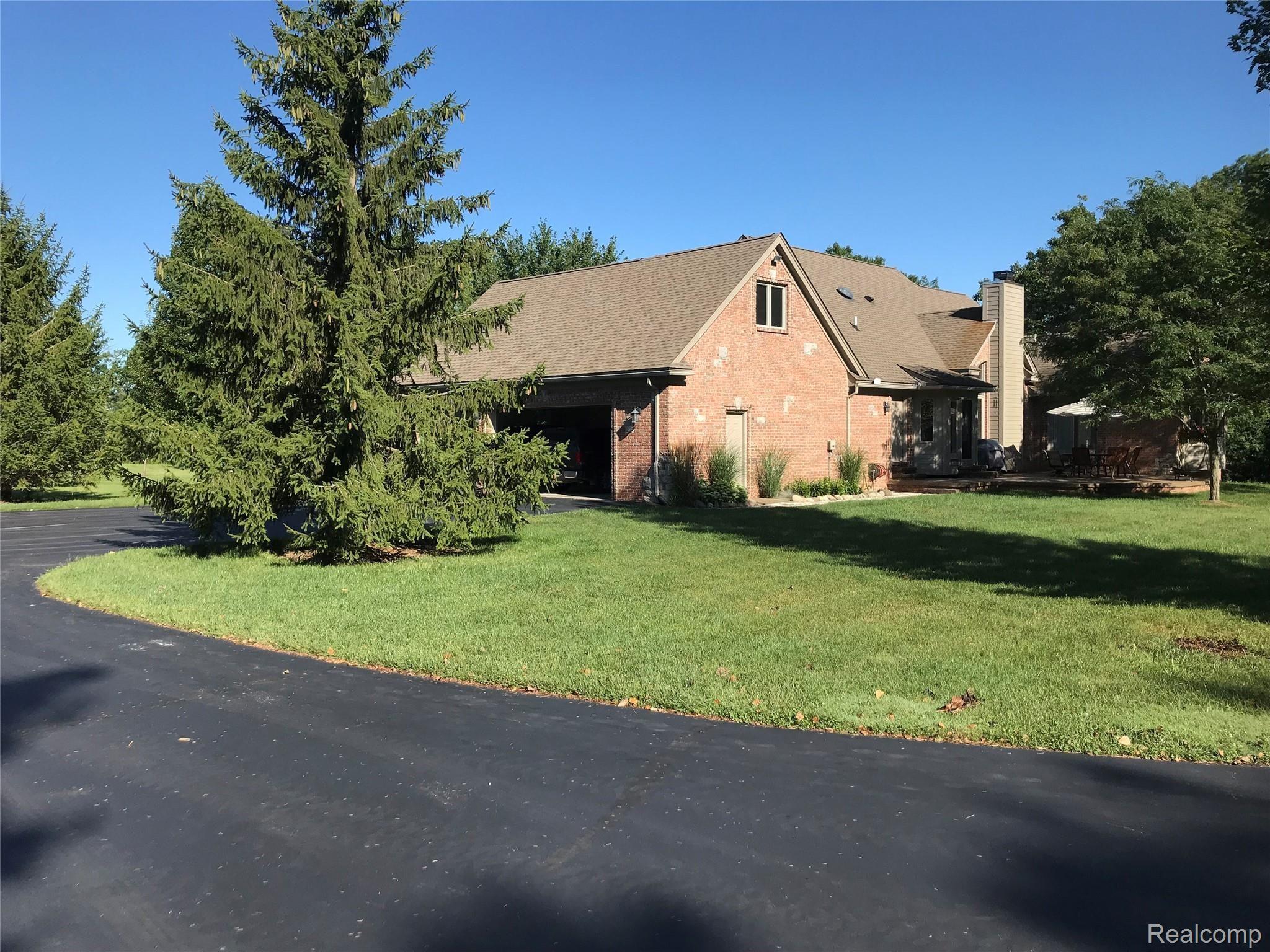 7296 Nollar Road Whitmore Lake, MI 48189 - Photo 14 of 55 BACK AND SIDE OF HOME