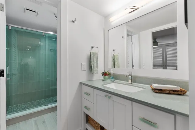 a bathroom with a sink and a mirror