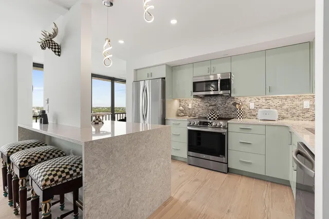 a kitchen with a stove and a refrigerator