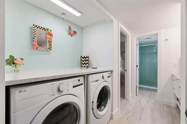 a bedroom with a large bed and a flat screen tv