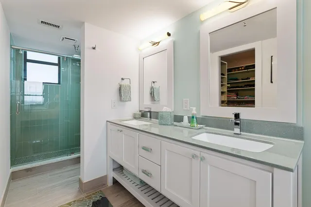 a bathroom with a shower and a toilet