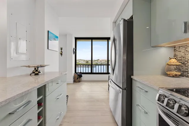 a balcony with furniture and a potted plant