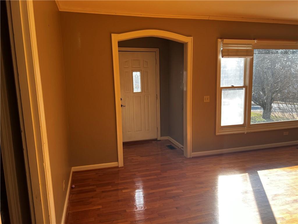 606 Pisgah Way Calhoun, GA 30701 - Photo 3 of 18 a view of hallway with windows and wooden floor