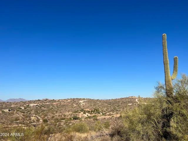 a view of a street with a building in the background