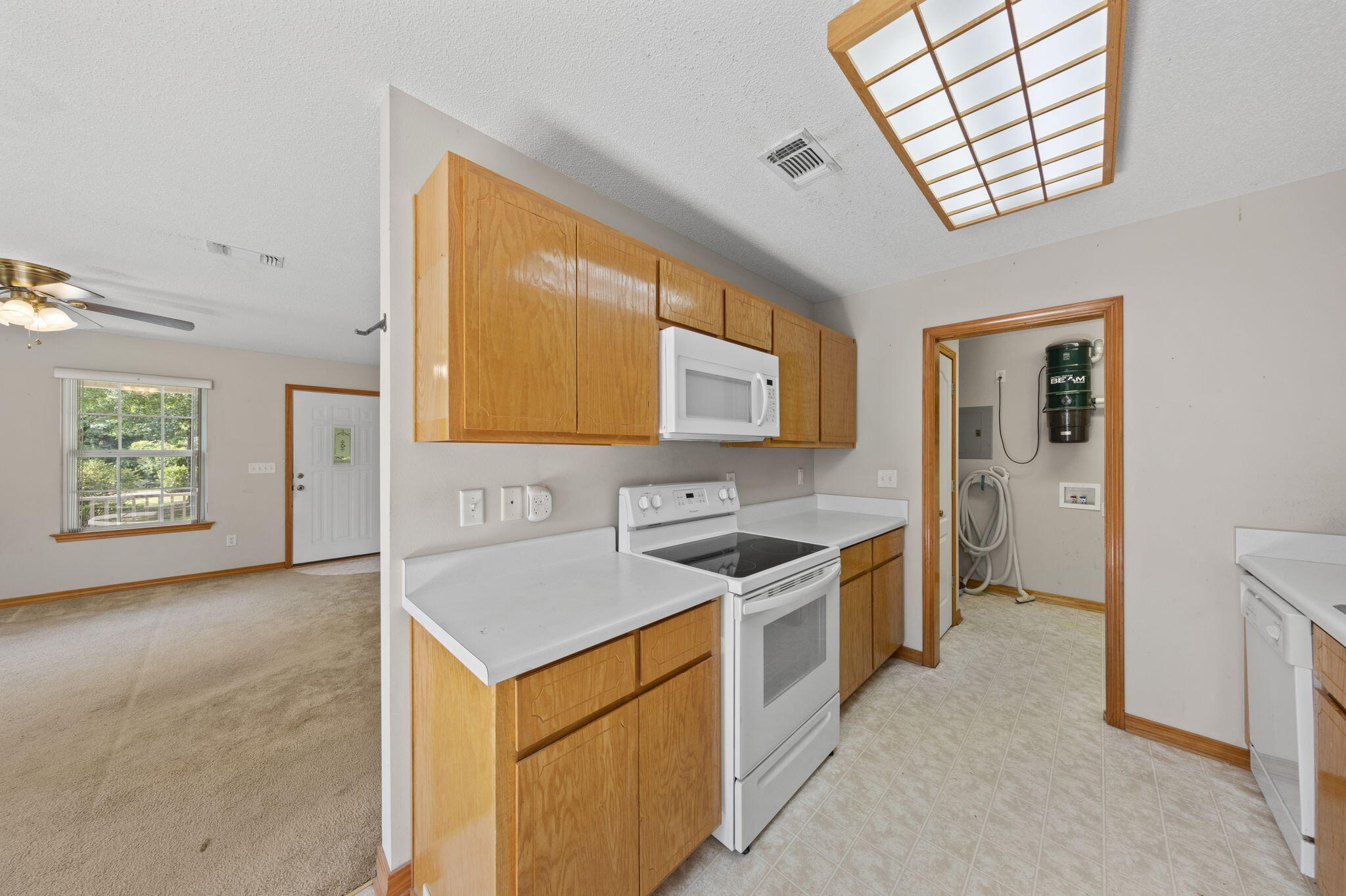3435 Fl-2 Laurel Hill Laurel Hill, FL 32567 - Photo 13 of 39 a kitchen that has a sink a stove and a microwave oven