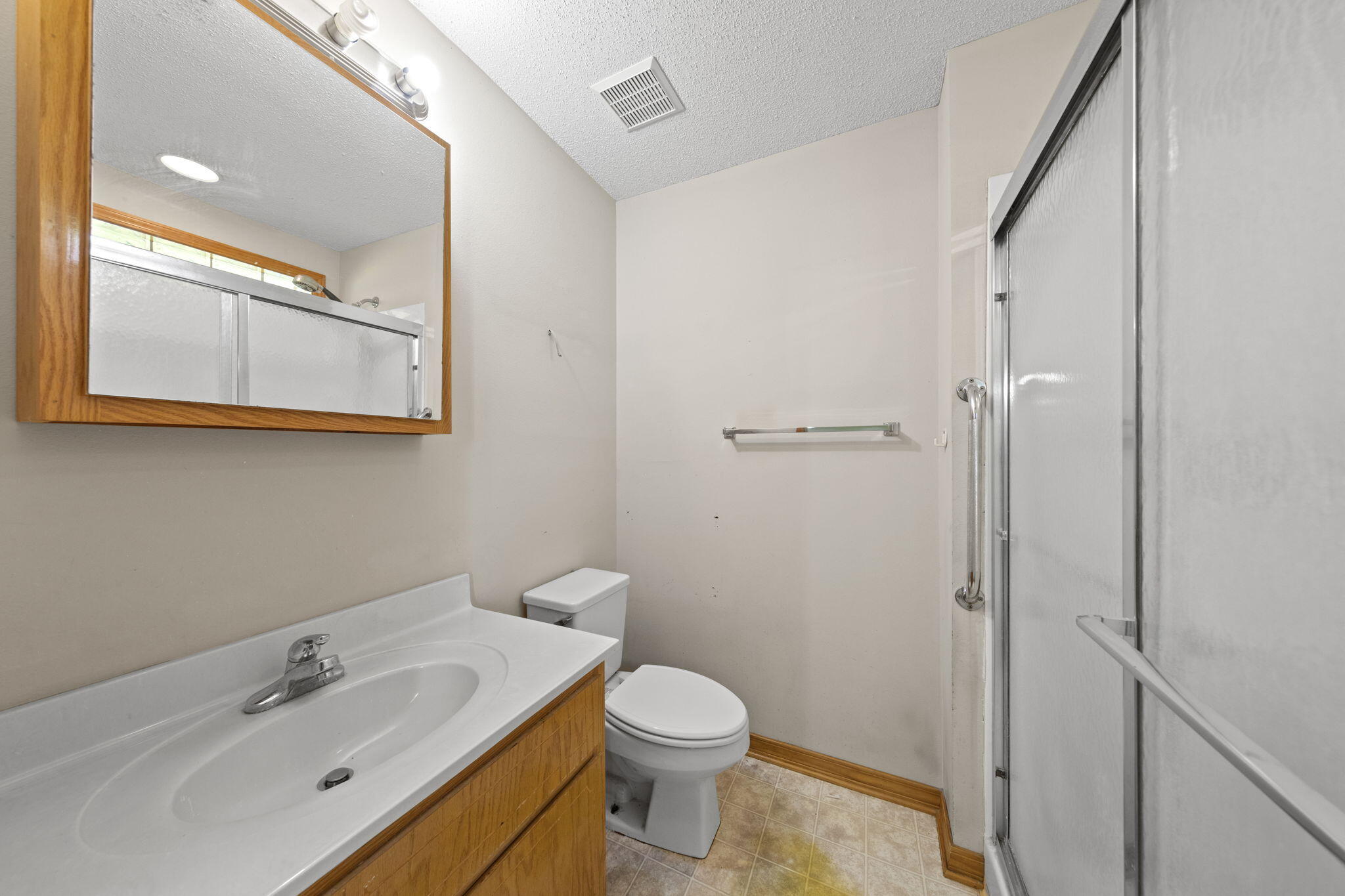 3435 Fl-2 Laurel Hill Laurel Hill, FL 32567 - Photo 19 of 39 a bathroom with a sink a toilet and shower