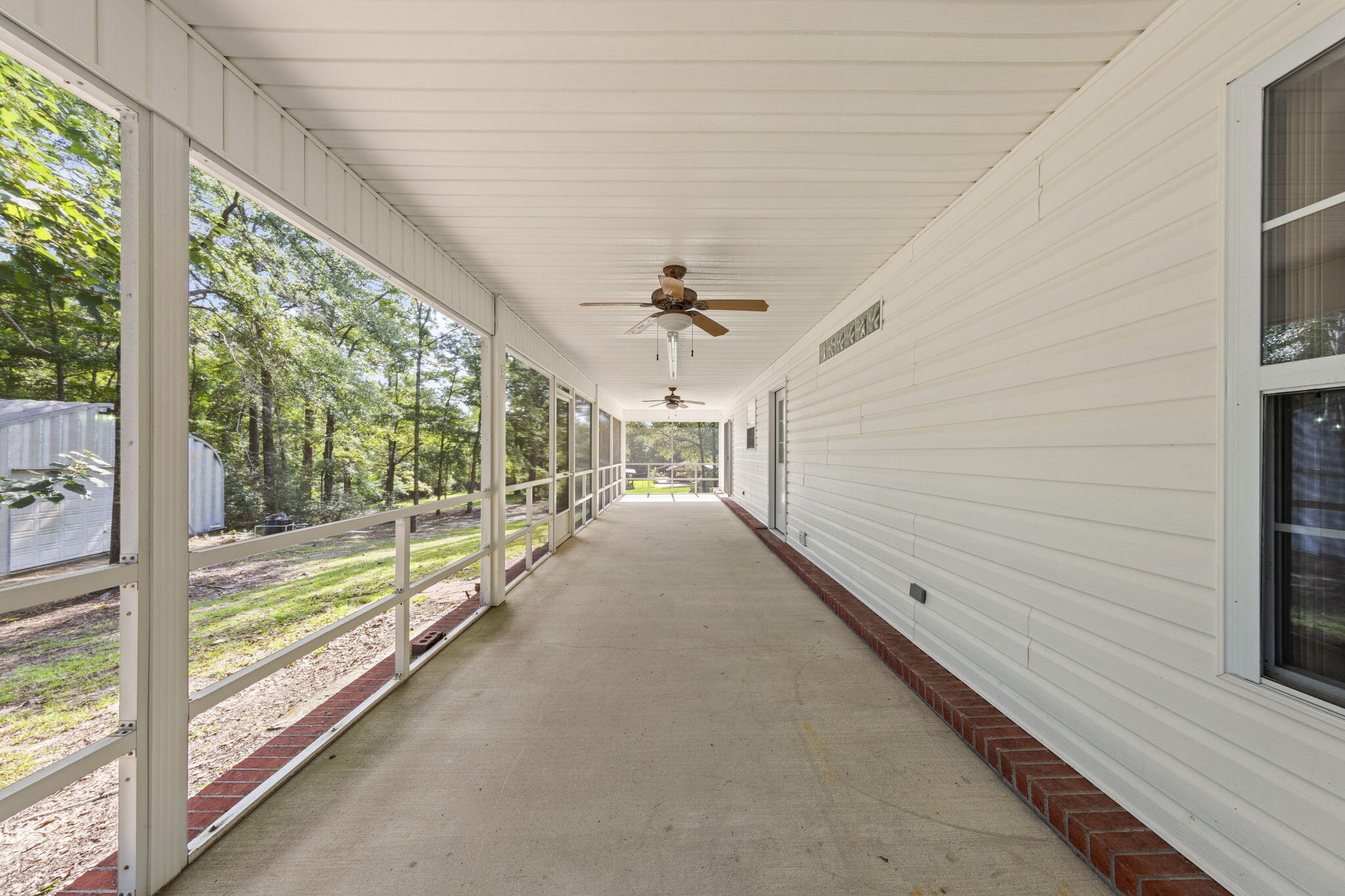 3435 Fl-2 Laurel Hill Laurel Hill, FL 32567 - Photo 21 of 39 a view of a porch and garden