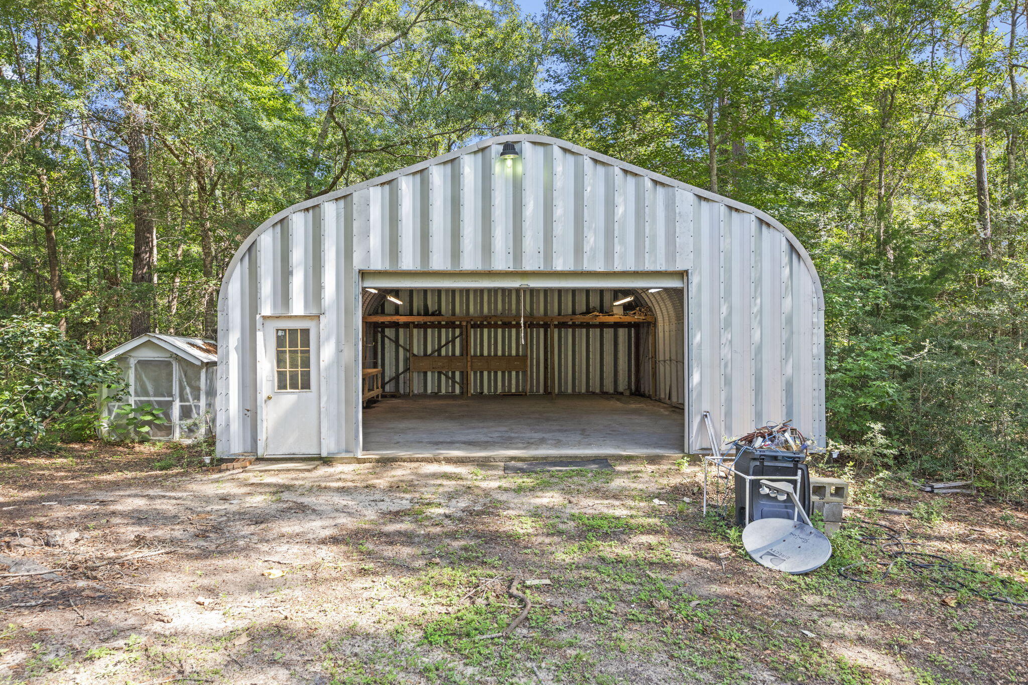 3435 Fl-2 Laurel Hill Laurel Hill, FL 32567 - Photo 27 of 39 a view of backyard with wooden fence and trees