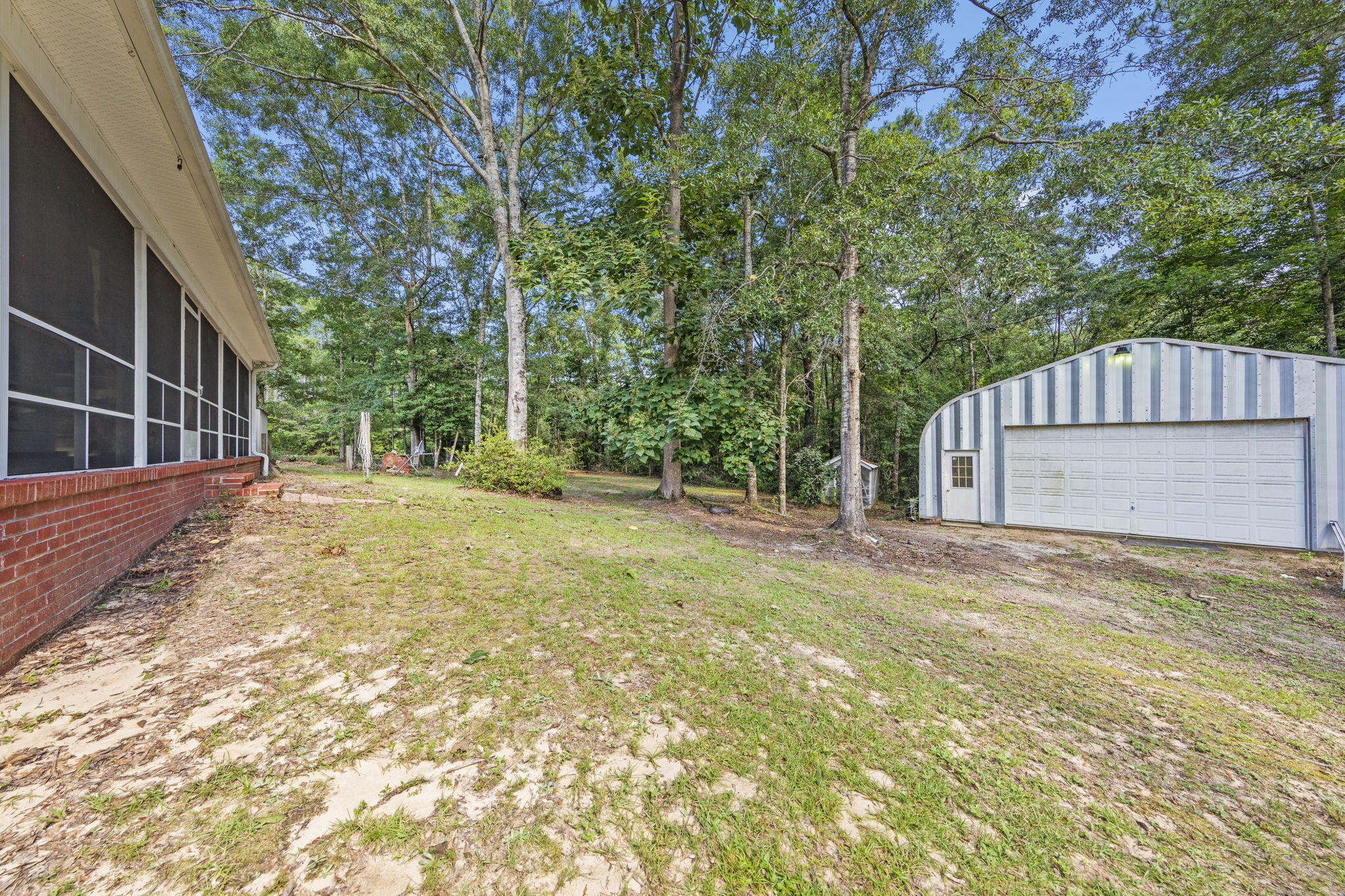 3435 Fl-2 Laurel Hill Laurel Hill, FL 32567 - Photo 29 of 39 a view of a house with backyard and tree