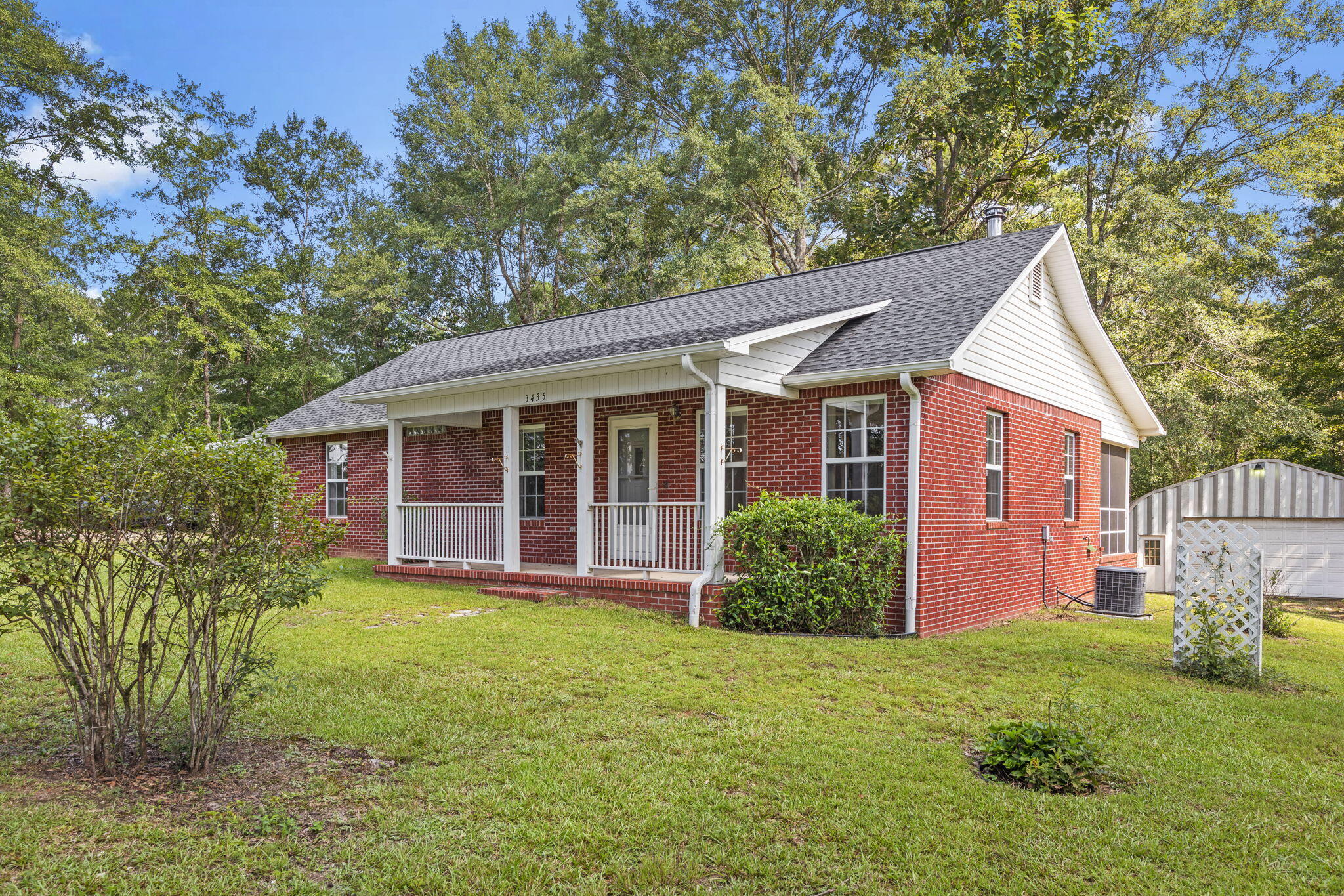3435 Fl-2 Laurel Hill Laurel Hill, FL 32567 - Photo 31 of 39 a view of a house with a yard and sitting area