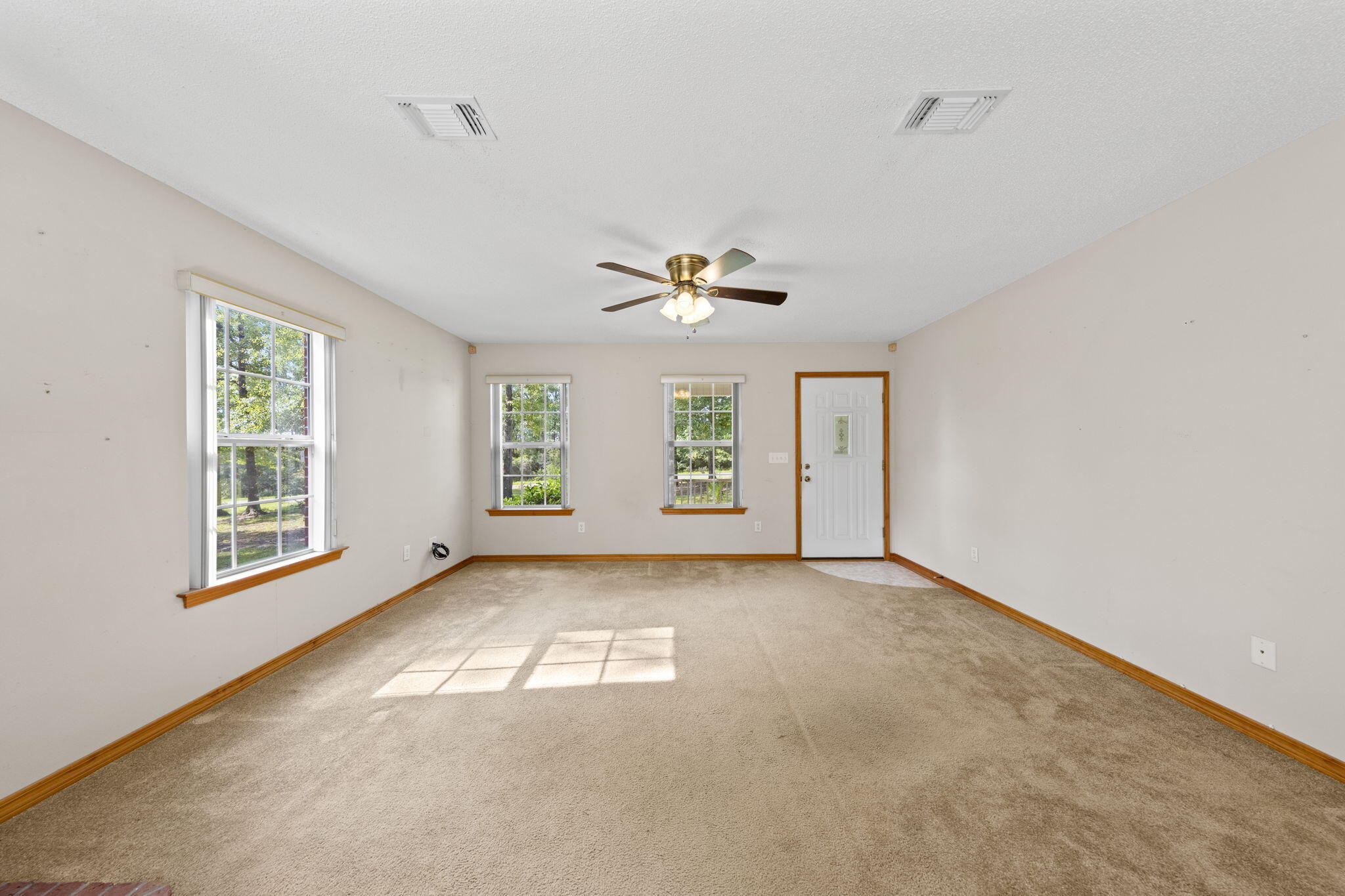 3435 Fl-2 Laurel Hill Laurel Hill, FL 32567 - Photo 6 of 39 a view of an empty room with a window