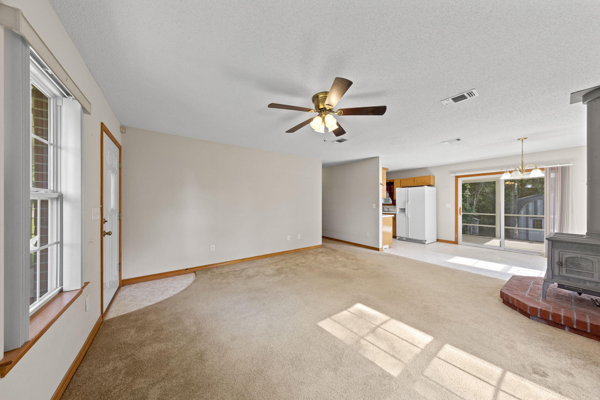 3435 Fl-2 Laurel Hill Laurel Hill, FL 32567 - Photo 7 of 39 a view of an empty room with a window and kitchen view