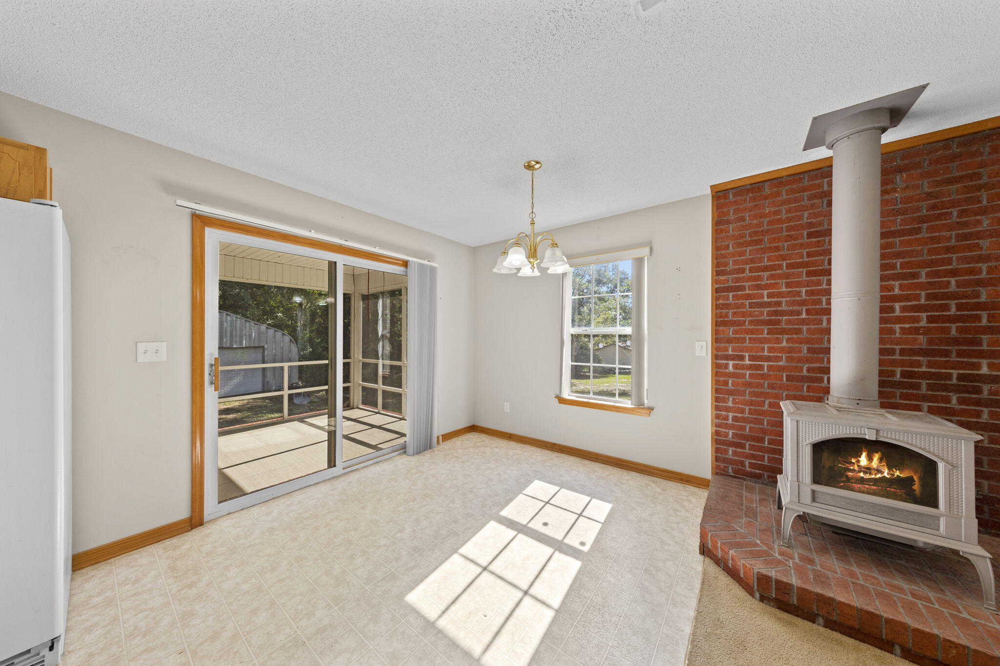 3435 Fl-2 Laurel Hill Laurel Hill, FL 32567 - Photo 10 of 39 a view of an empty room with a window and fire place