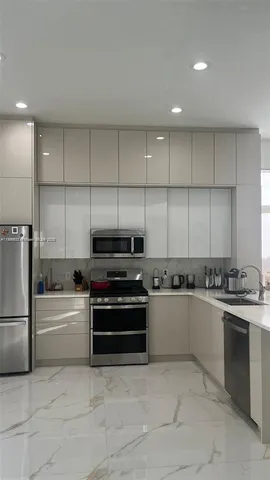 a kitchen with appliances and cabinets
