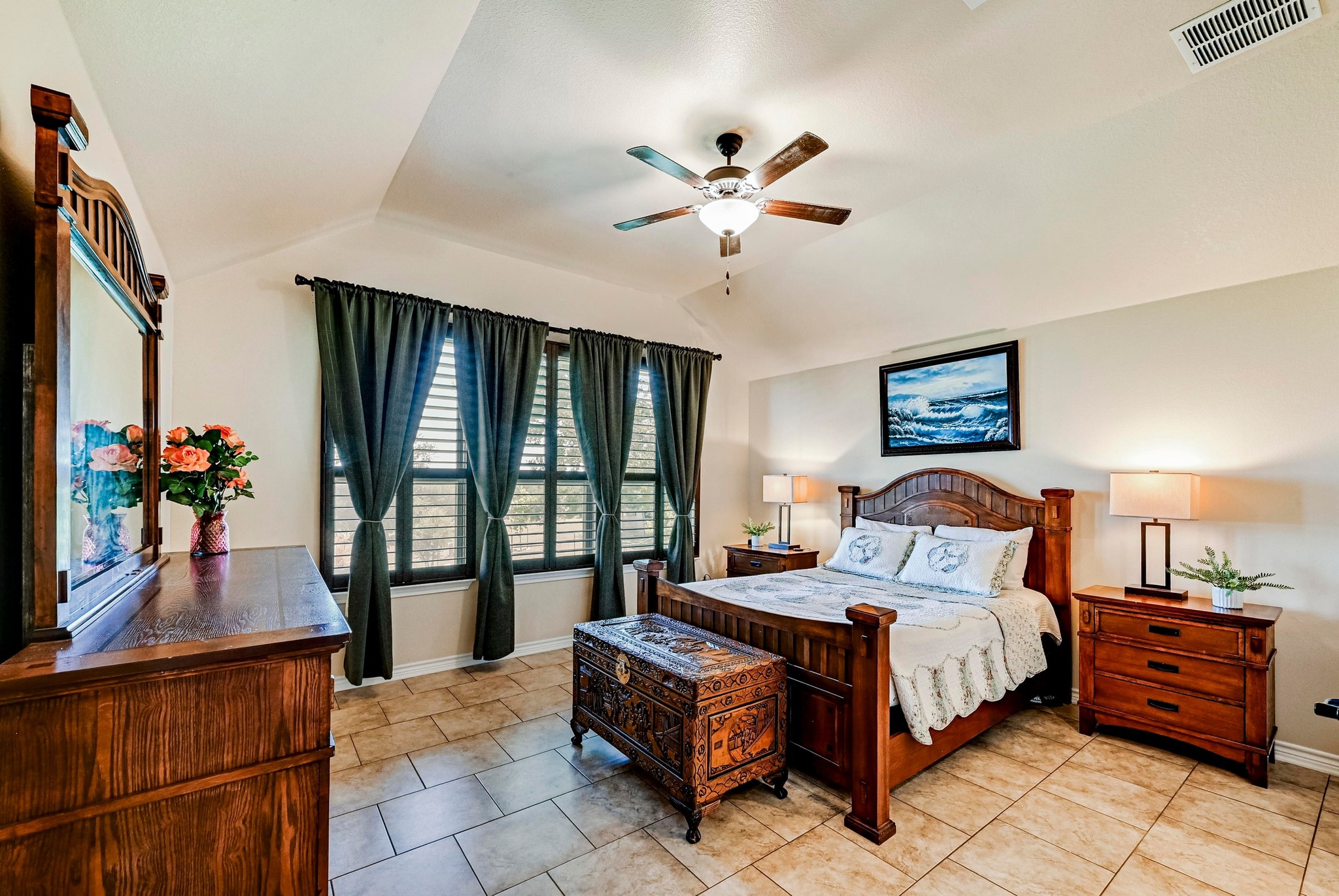 560 Saddle Ridge Drive Bertram, TX 78605 - Photo 11 of 27 a bedroom with a bed and a chandelier