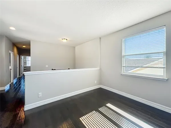 a spacious bathroom with a double vanity sink and mirror