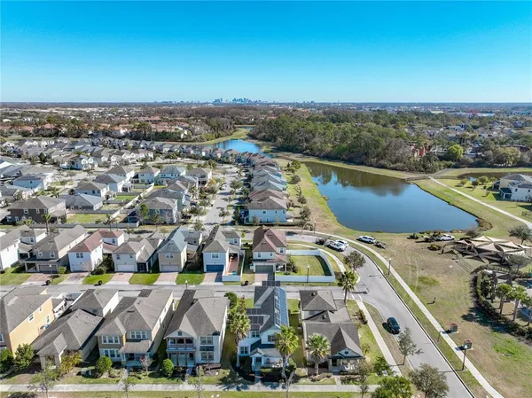 an aerial view of a house with a lake view