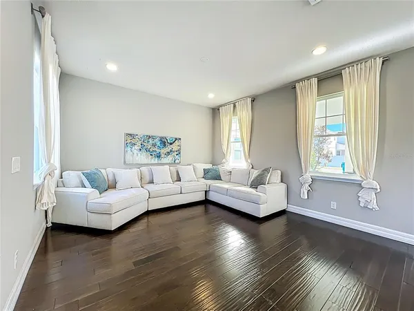 a living room with furniture and a large window