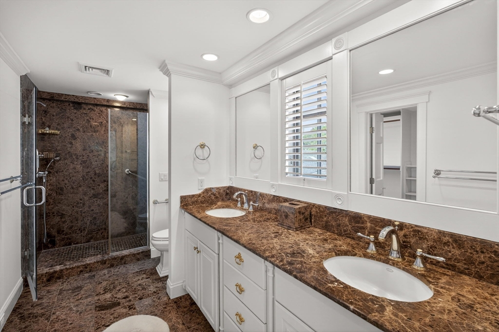 1114 Orleans Road, Unit 1 North Chatham, MA 02650 - Photo 31 of 42 a spacious bathroom with a shower sink and mirror