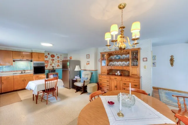 a bedroom with furniture and a chandelier