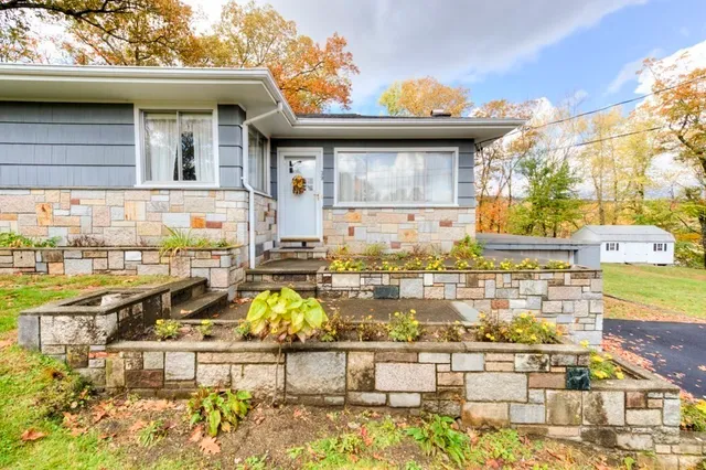 a view of a swimming pool with an outdoor seating