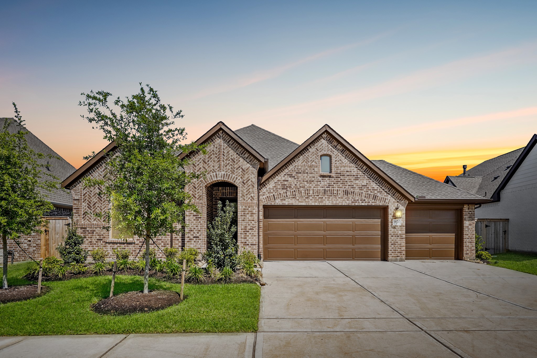 1420 Florecer Lane Magnolia, TX 77354 - Photo 1 of 22 a front view of a house with garden