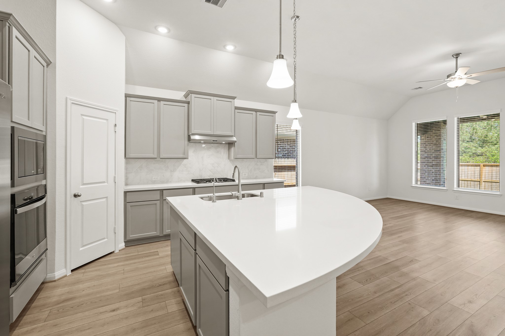 1420 Florecer Lane Magnolia, TX 77354 - Photo 13 of 22 a large kitchen with stainless steel appliances granite countertop a sink a stove and a refrigerator