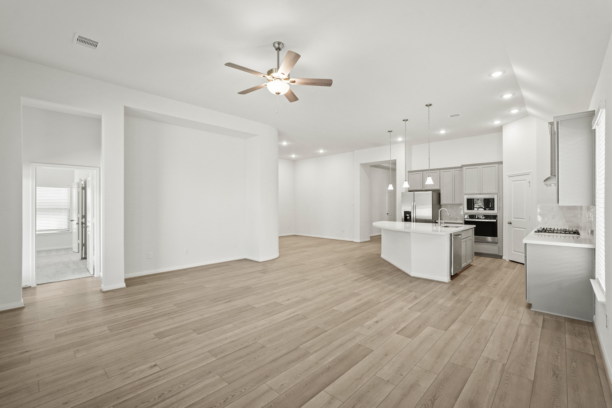1420 Florecer Lane Magnolia, TX 77354 - Photo 15 of 22 a view of kitchen with kitchen island wooden floors appliances and cabinets
