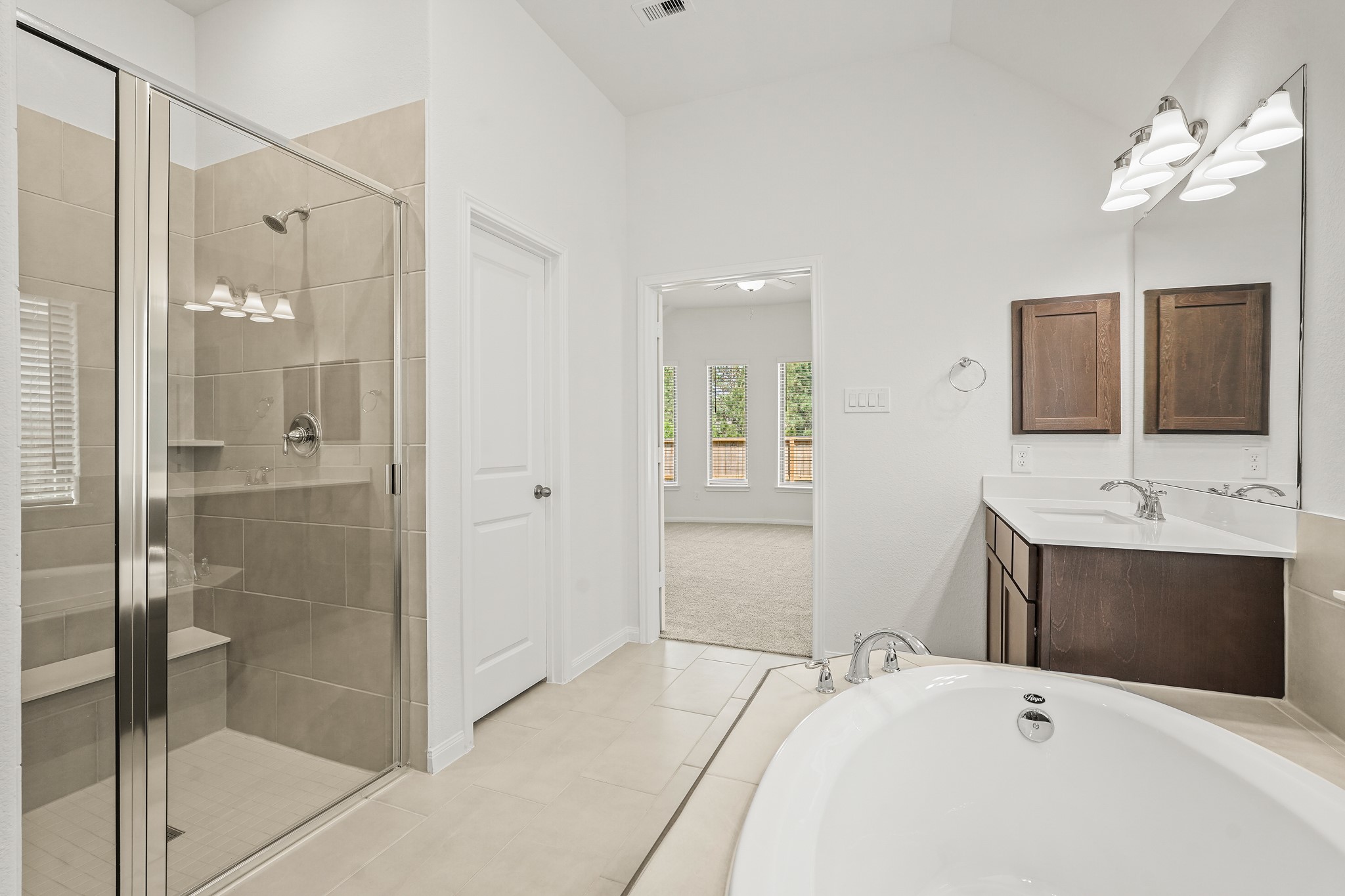 1420 Florecer Lane Magnolia, TX 77354 - Photo 19 of 22 a bathroom with a tub a sink and mirror