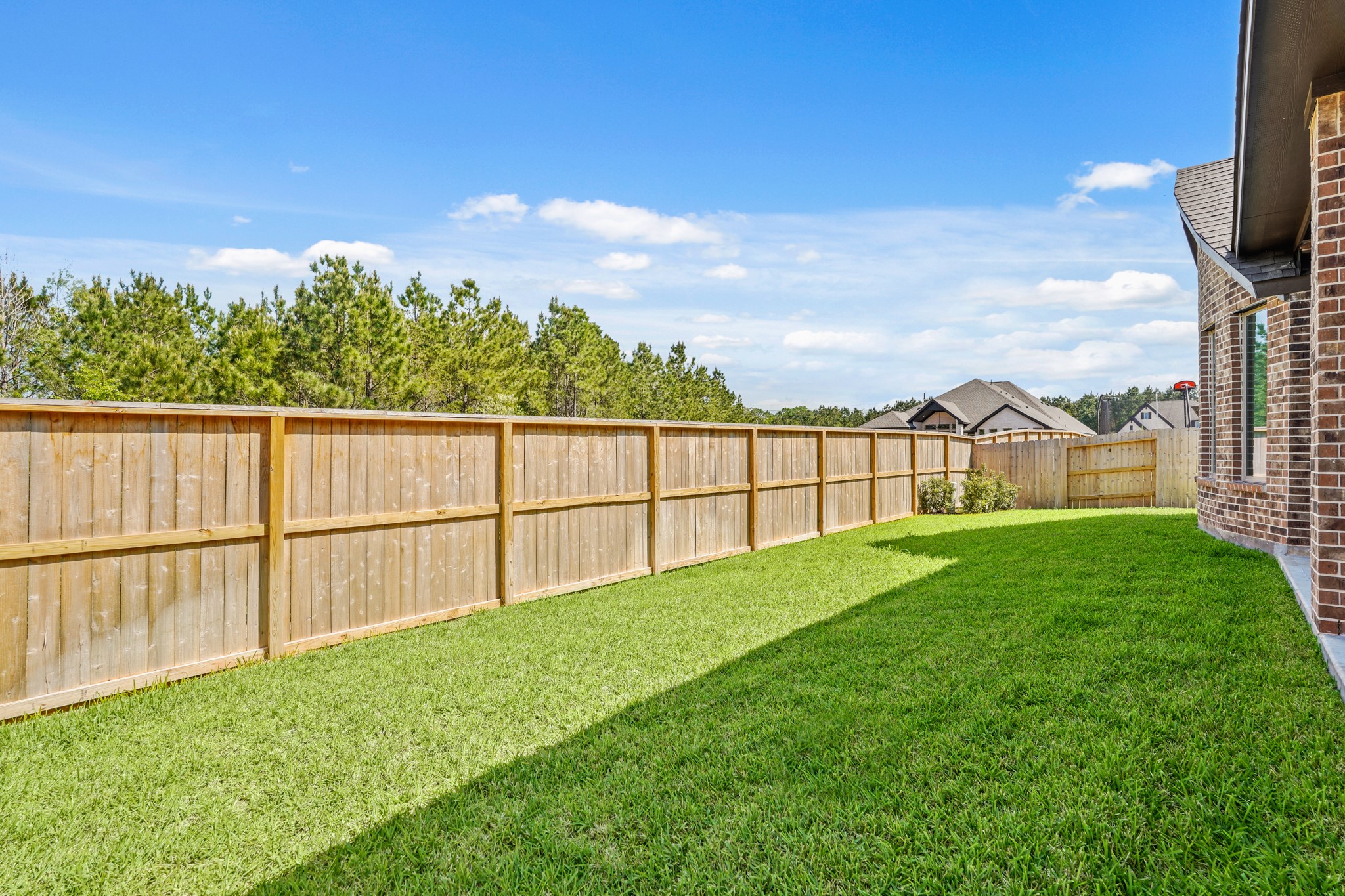 1420 Florecer Lane Magnolia, TX 77354 - Photo 22 of 22 a view of a backyard with a garden