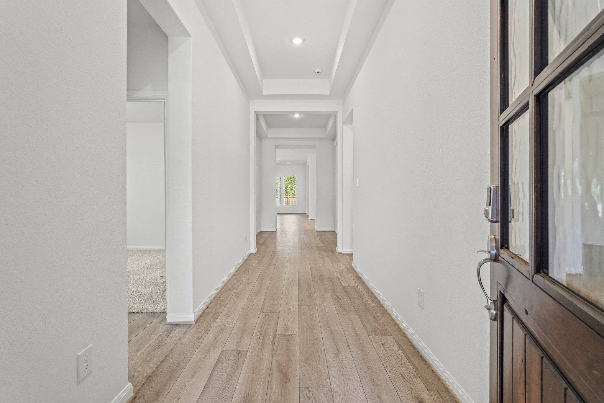 1420 Florecer Lane Magnolia, TX 77354 - Photo 3 of 22 a view of a hallway with wooden floor and staircase