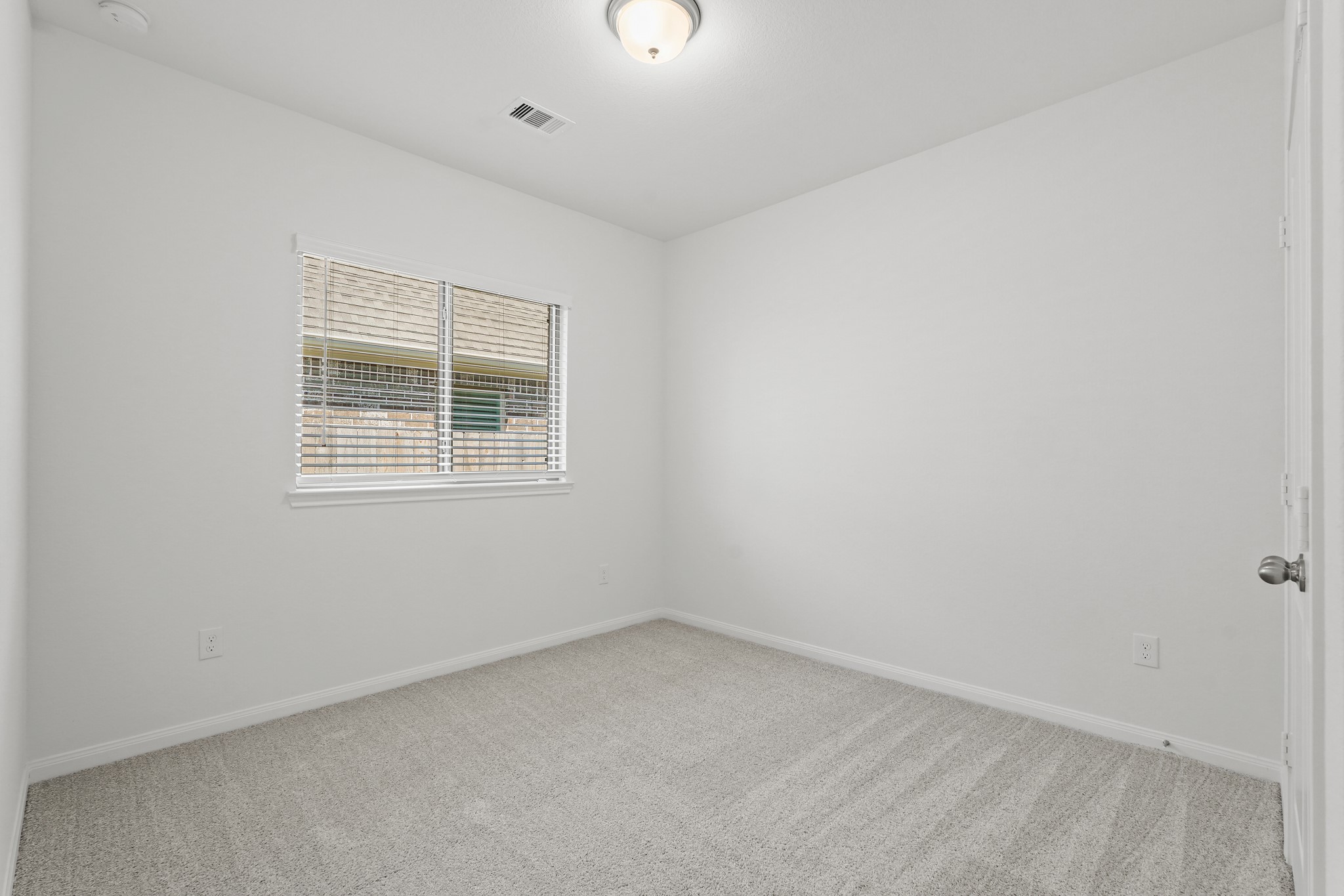 1420 Florecer Lane Magnolia, TX 77354 - Photo 6 of 22 an empty room with a window