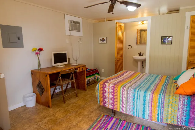 a bedroom with a bed and a table in it