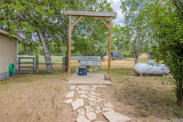 a backyard of a house with seating space